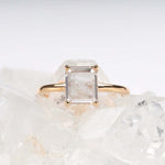Load image into Gallery viewer, Close-up of diamond ring on a fabric surface

