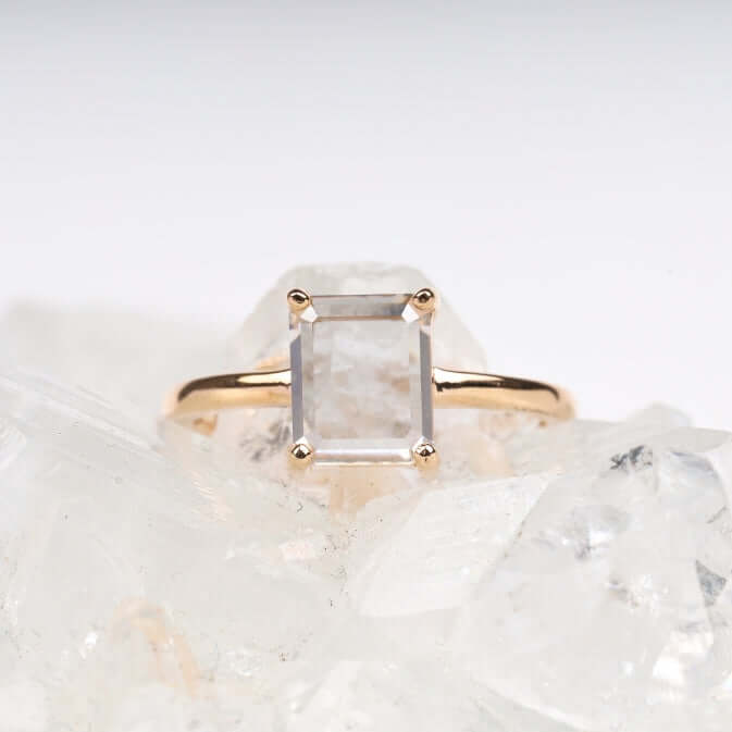 Close-up of diamond ring on a fabric surface