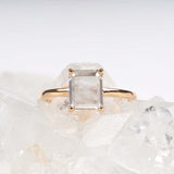 Close-up of diamond ring on a fabric surface