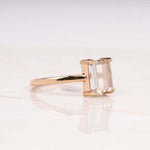 Load image into Gallery viewer, Radiant diamond ring shown from above on a white cloth
