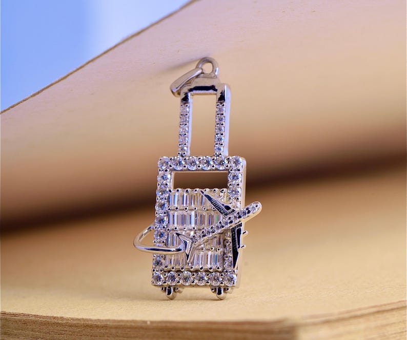 Crystal-Studded Travel Charm Pendant – Airplane & Suitcase Design