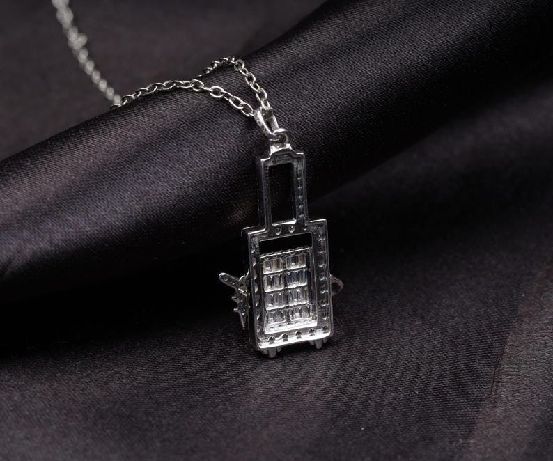 Crystal-Studded Travel Charm Pendant – Airplane & Suitcase Design