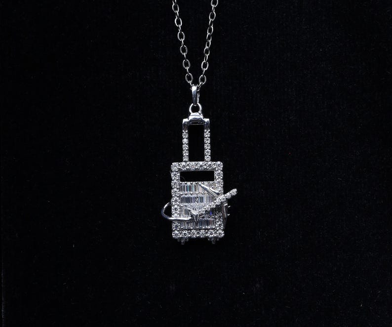 Crystal-Studded Travel Charm Pendant – Airplane & Suitcase Design
