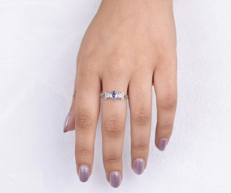 Blue Oval Gemstone Ring with Floral Diamond Accents
