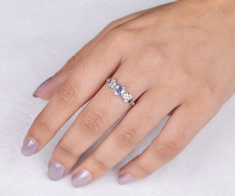 Blue Oval Gemstone Ring with Floral Diamond Accents