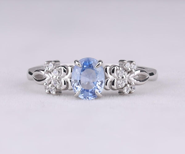 Blue Oval Gemstone Ring with Floral Diamond Accents