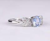 Blue Oval Gemstone Ring with Floral Diamond Accents