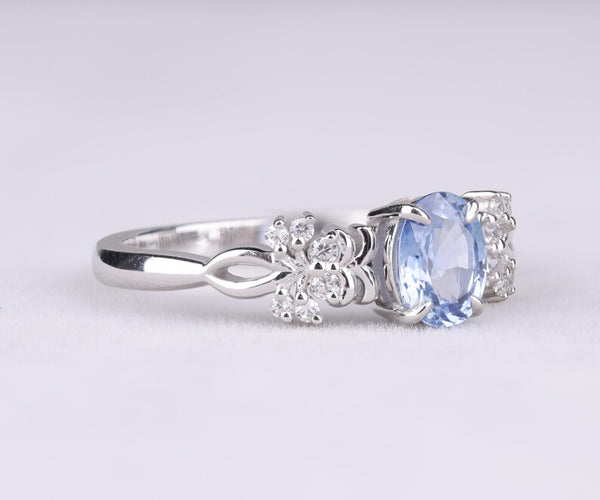 Blue Oval Gemstone Ring with Floral Diamond Accents