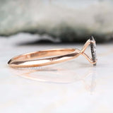 Top view of engagement ring with four prong setting and sleek silver band