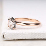 Hand holding four prong set ring – showcasing minimalist bridal jewelry