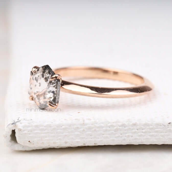 Hand holding four prong set ring – showcasing minimalist bridal jewelry